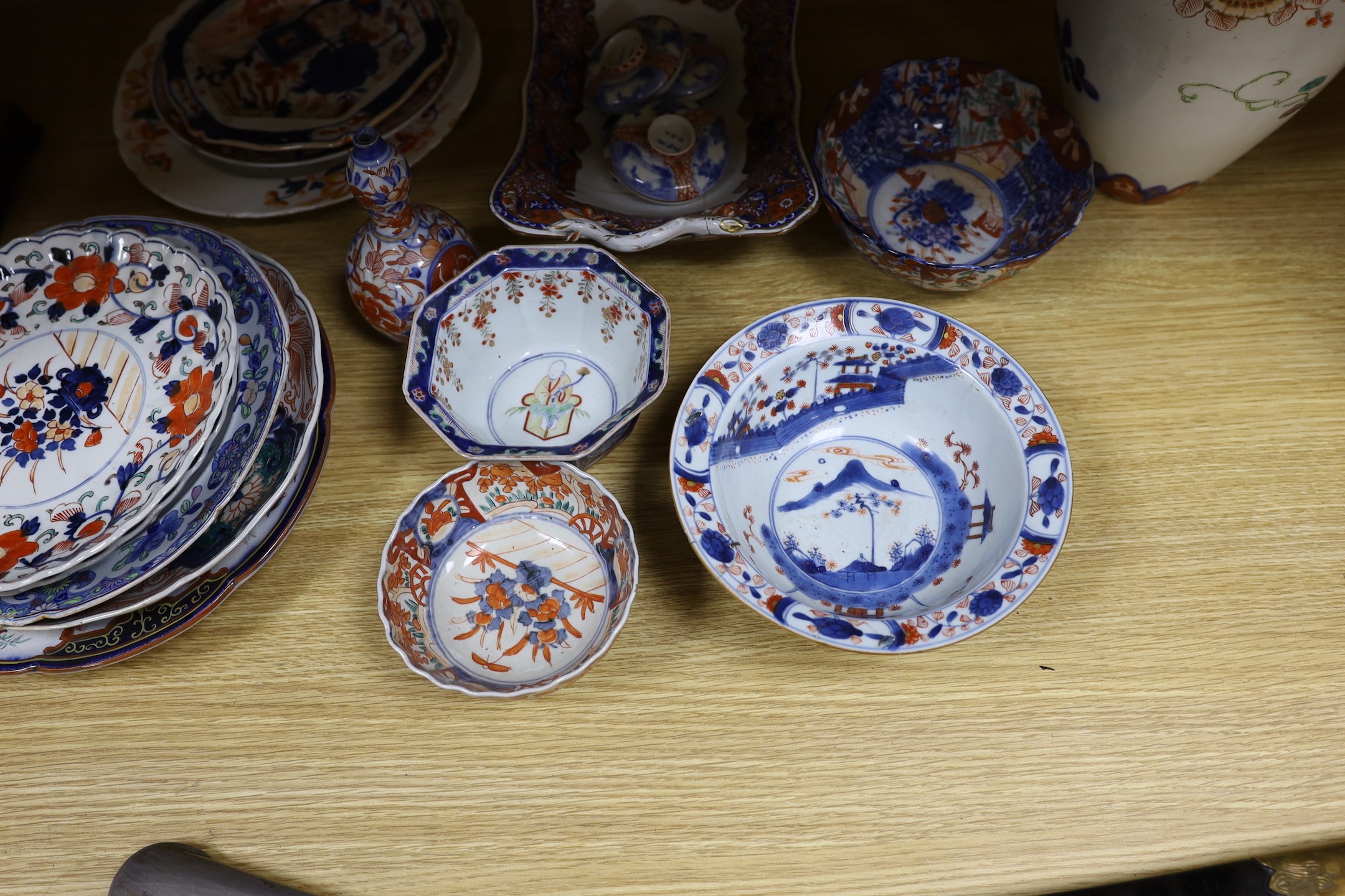 A Japanese Imari two handled vase, a Kangxi Imari bowl a/f and a collection of similar Japanese and continental ceramics